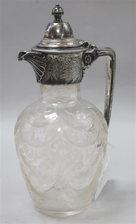 An Edwardian silver plated engraved glass claret jug